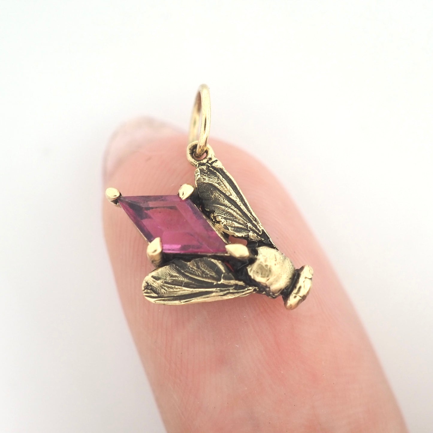 Fly charm with pink sapphire