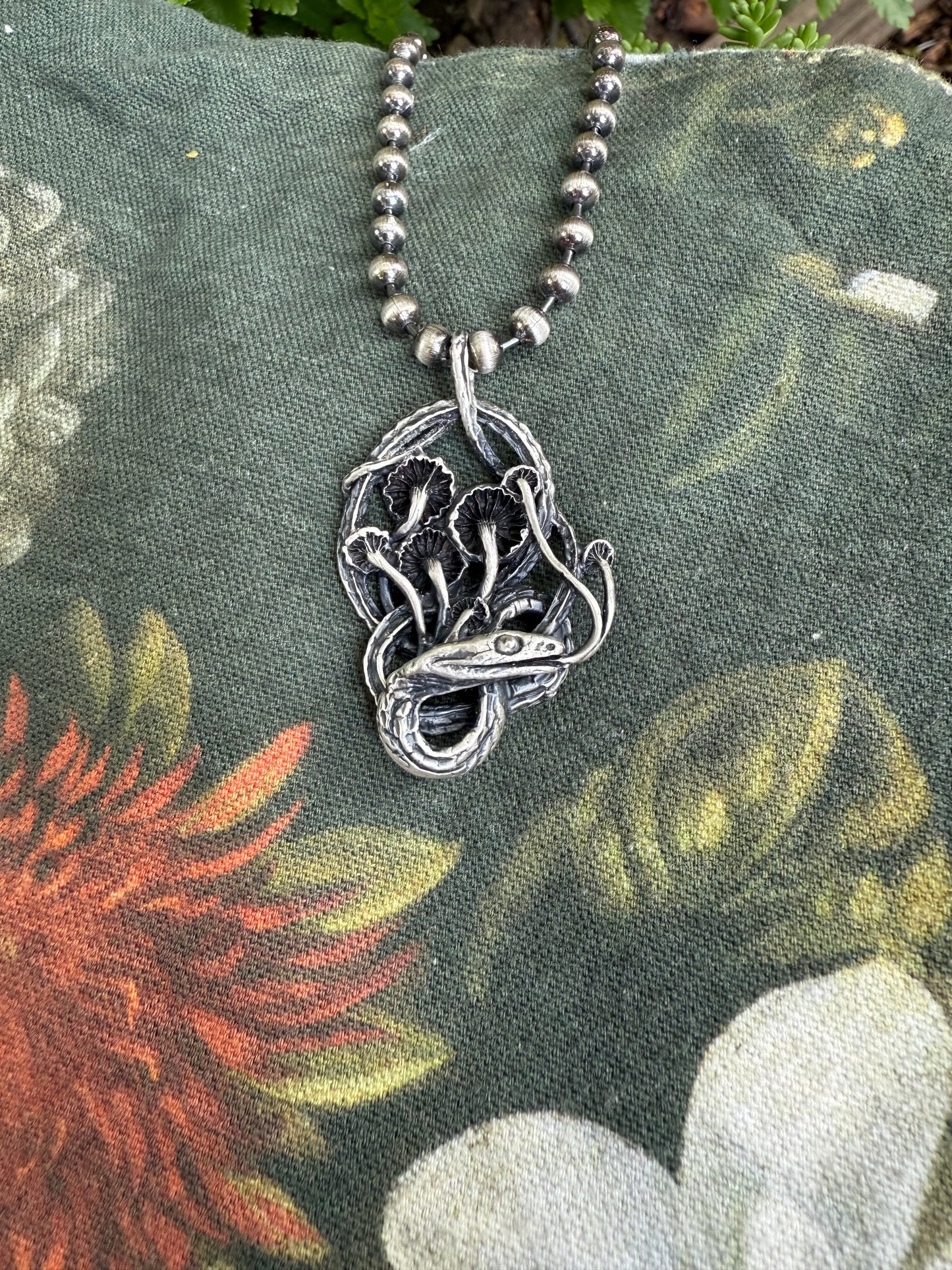 Serpent and mushrooms necklace
