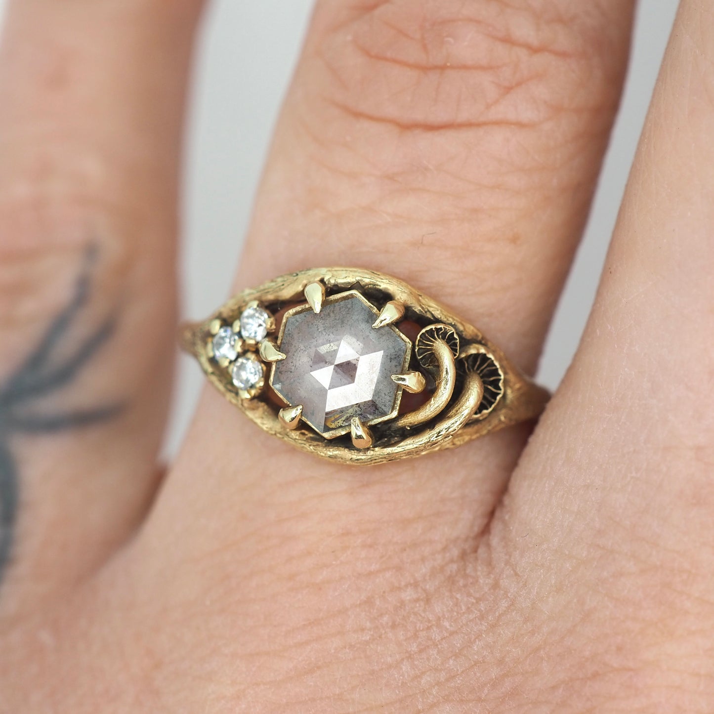 Caldera ring with salt and pepper diamond