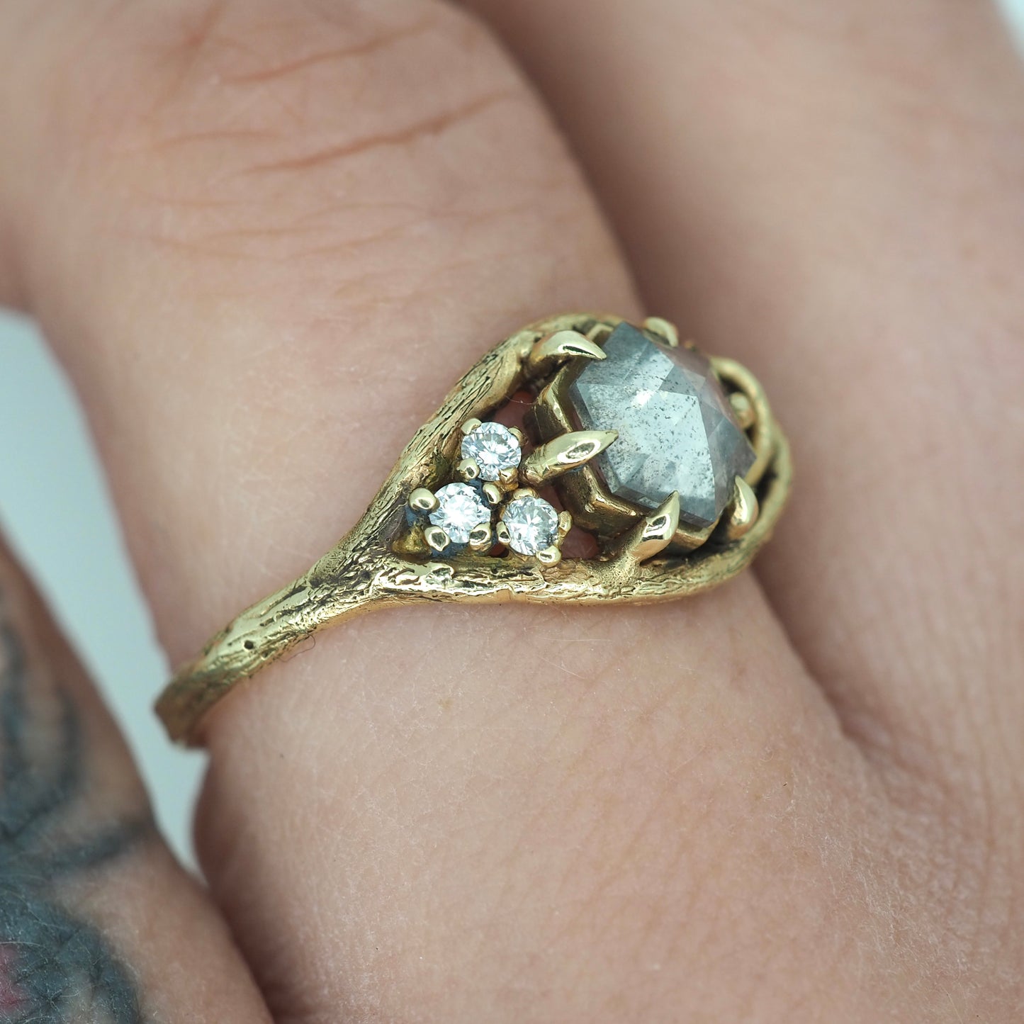 Caldera ring with salt and pepper diamond