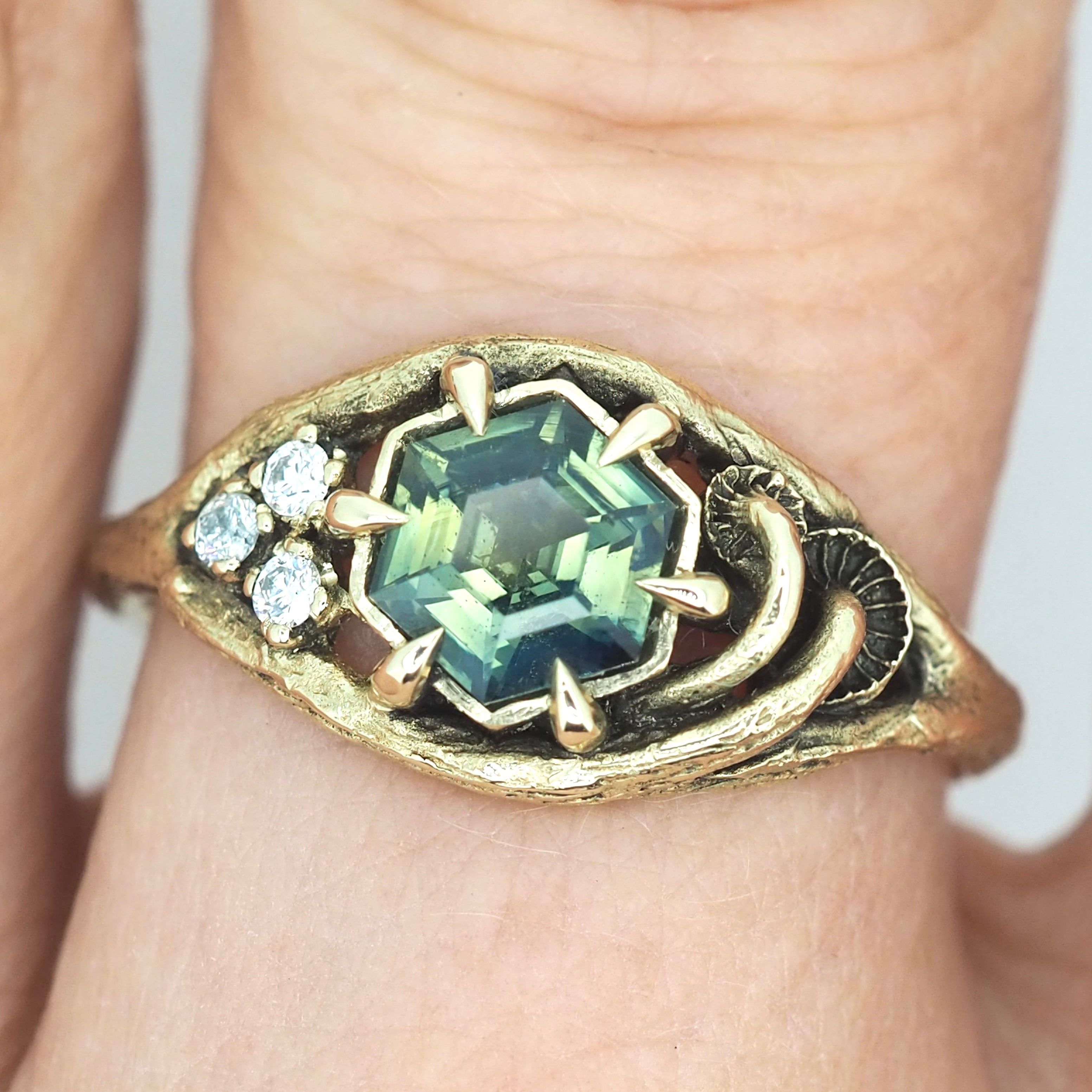 Caldera ring with sapphire and diamonds