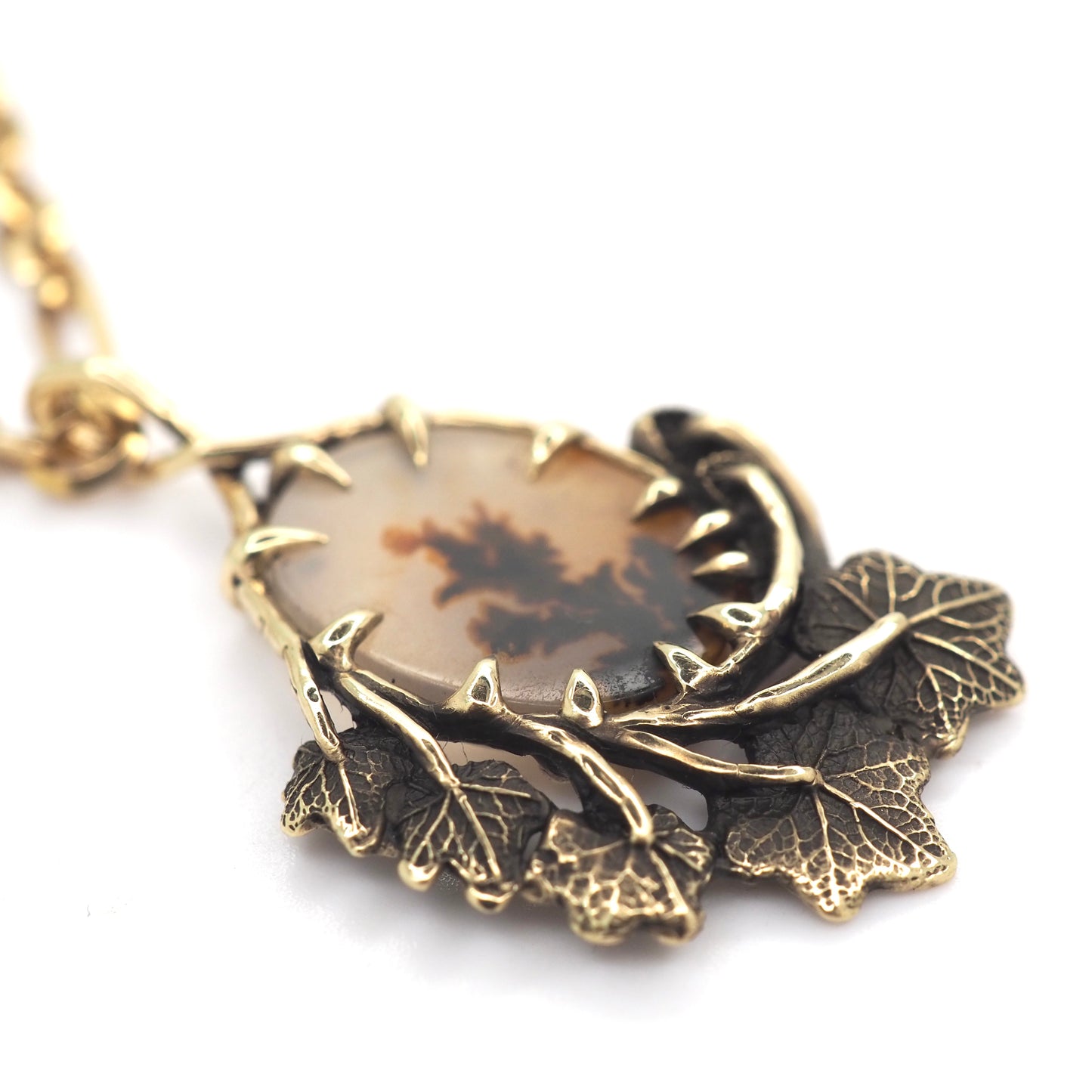 Framed dendritic agate pendant