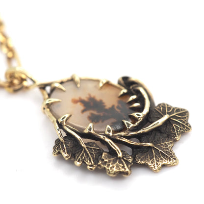 Framed dendritic agate pendant
