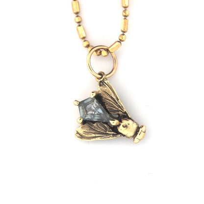Fly charm with Montana sapphire