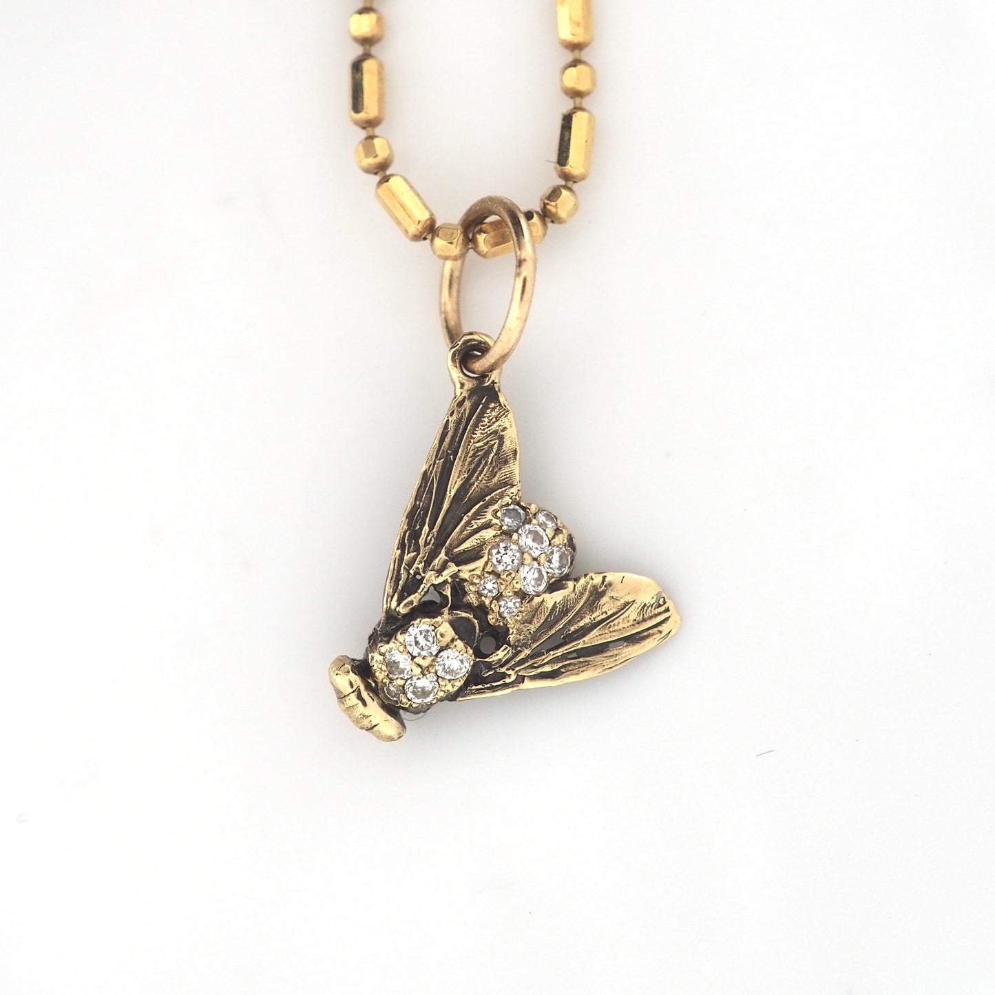 Fly charm with diamonds