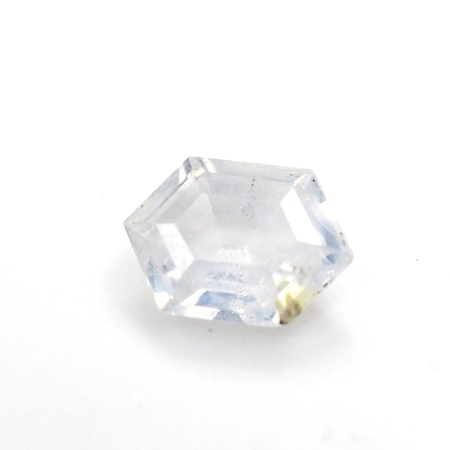 Milky white sapphire hexagon step cut .55ct