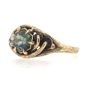 Caldera ring with sapphire and diamonds