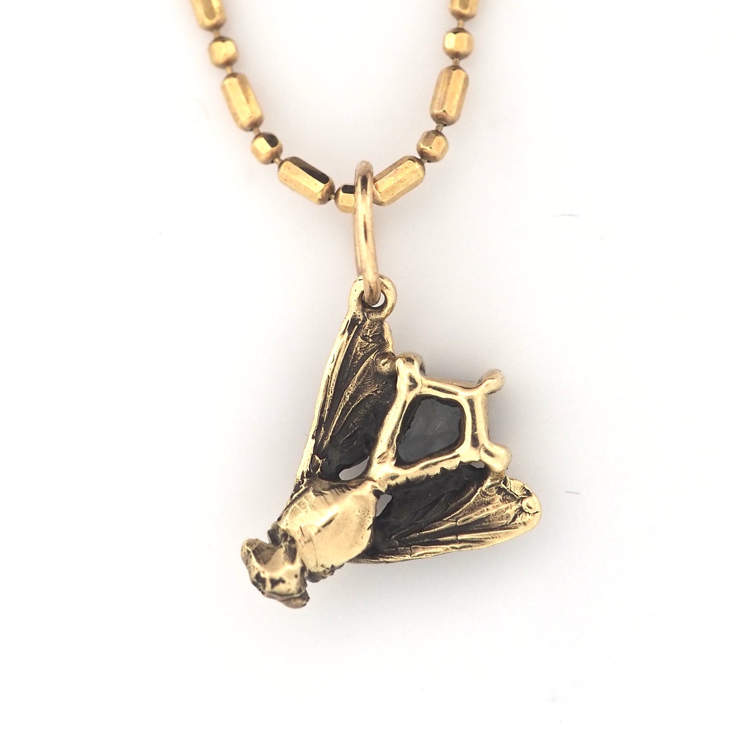 Fly charm with Montana sapphire