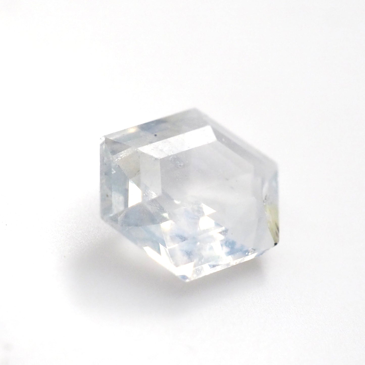 Milky white sapphire hexagon step cut .55ct