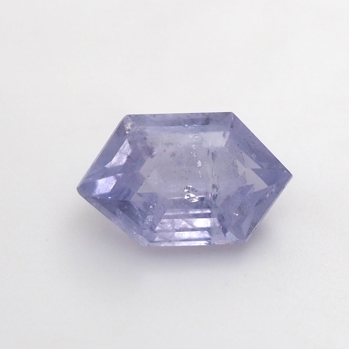 Milky lilac sapphire hexagon step cut .6ct