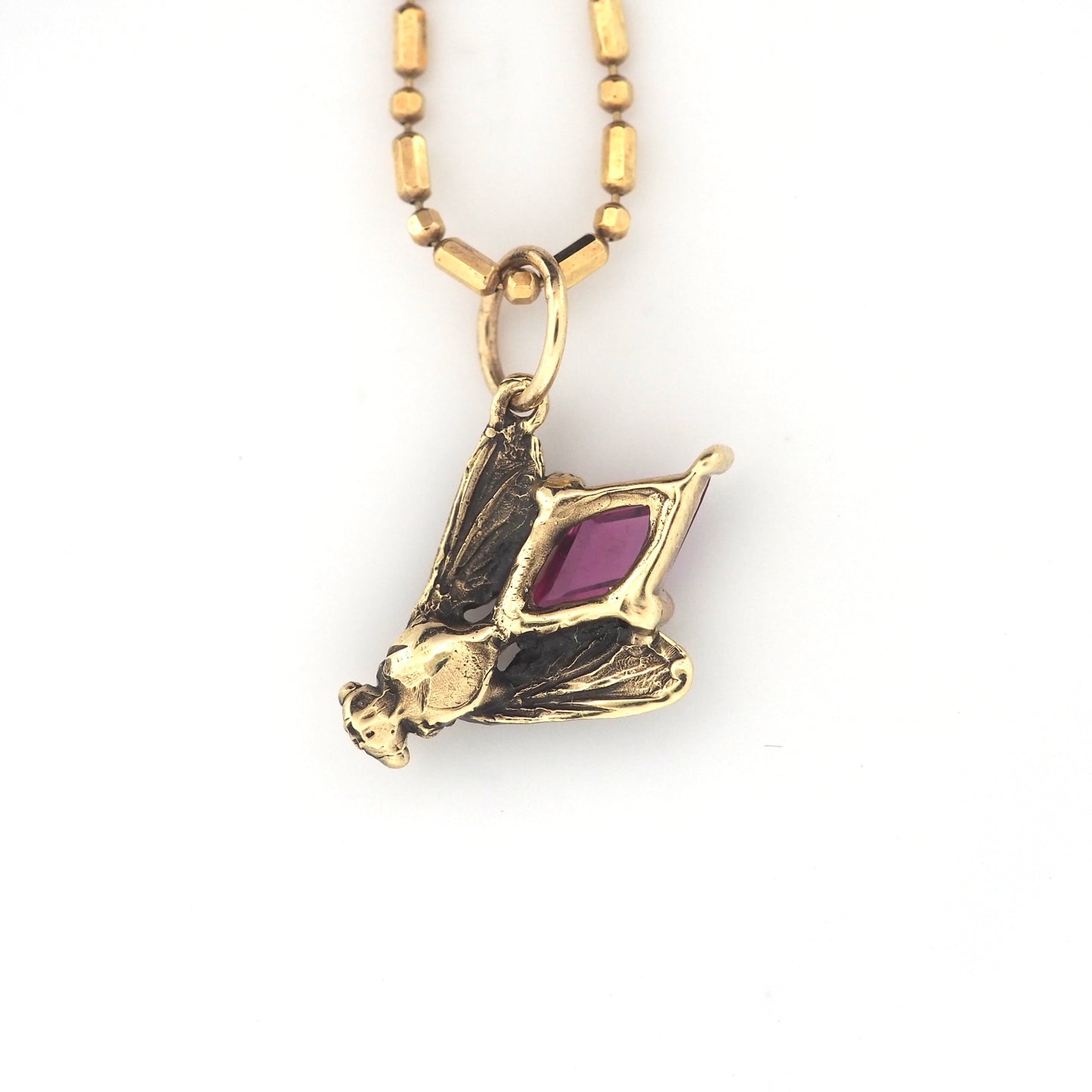 Fly charm with pink sapphire