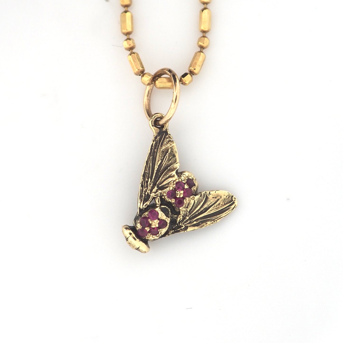 Fly charm with rubies
