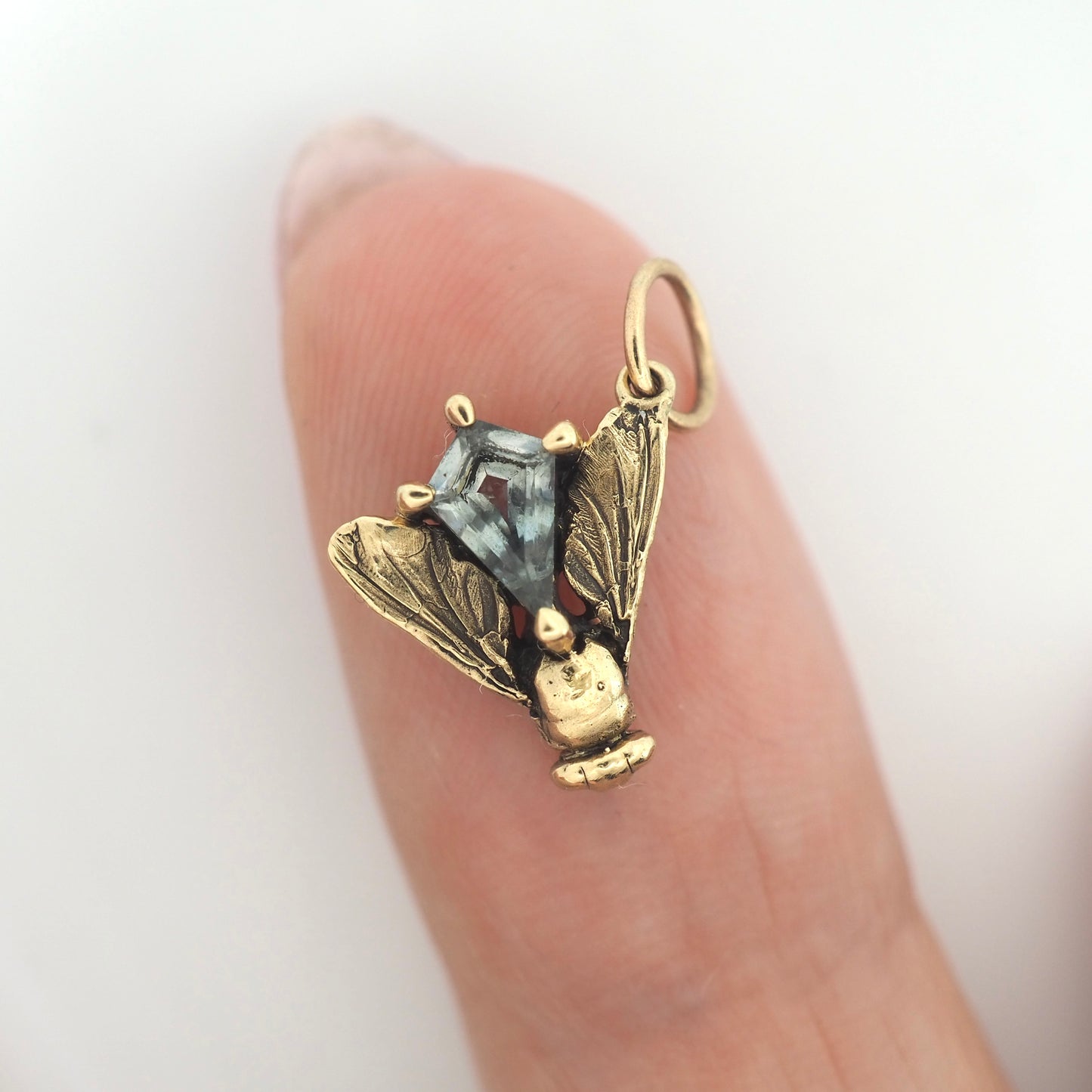 Fly charm with Montana sapphire